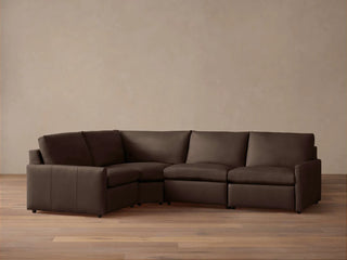 Kipton Slim Arm Leather Four-Piece Motion Sectional