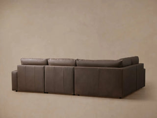 Kipton Wide Arm Leather Four-Piece Motion Sectional