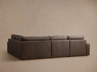 Kipton Wide Arm Leather Four-Piece Motion Sectional